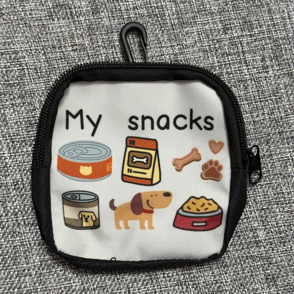 Small pet treat pouch with dog cartoon, snack images, and zipper on gray fabric background