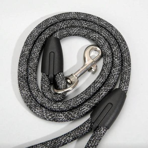 Durable gray rope pet leash with metal clasp and black plastic grips on white background