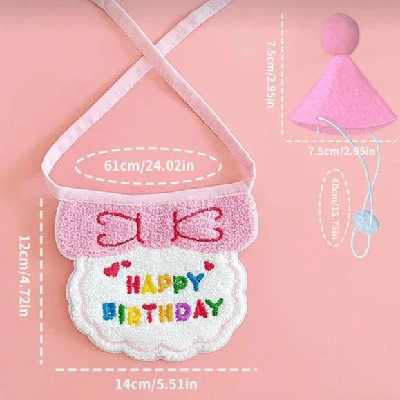 Pet birthday costume set with pink bow bib and party hat, labeled measurements, on pink background.