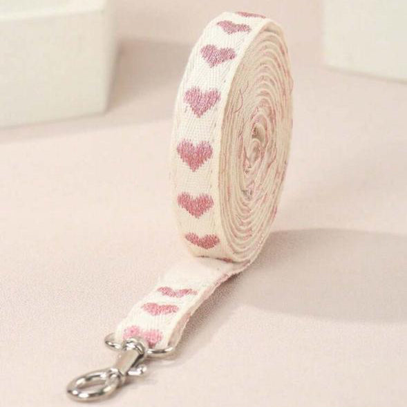 Cute pet leash with pink heart pattern on soft fabric, perfect for stylish dogs or cats.