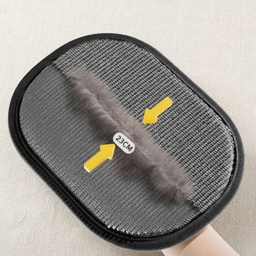 Pet grooming brush with collected fur and 23cm measurement, close-up view