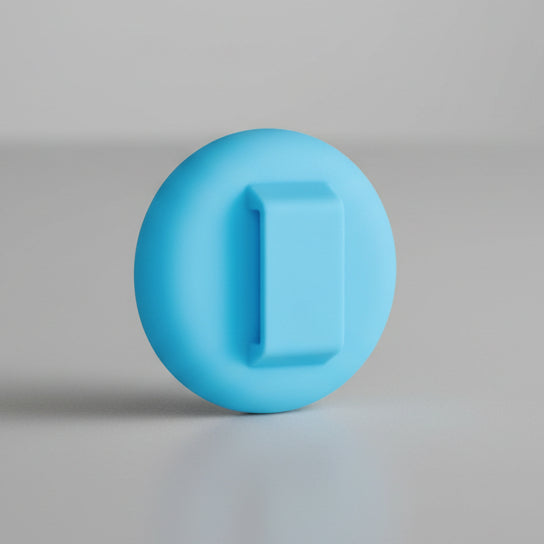 Blue silicone pet tag holder accessory on a plain gray background