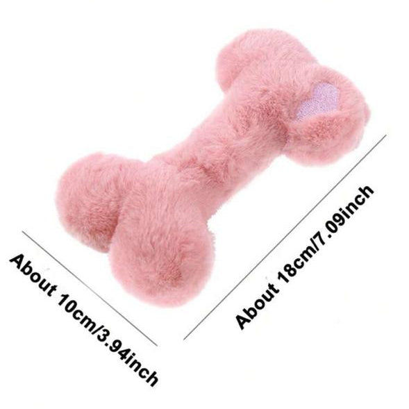 Soft pink plush dog bone toy with heart detail and measurements, pet accessory for dogs