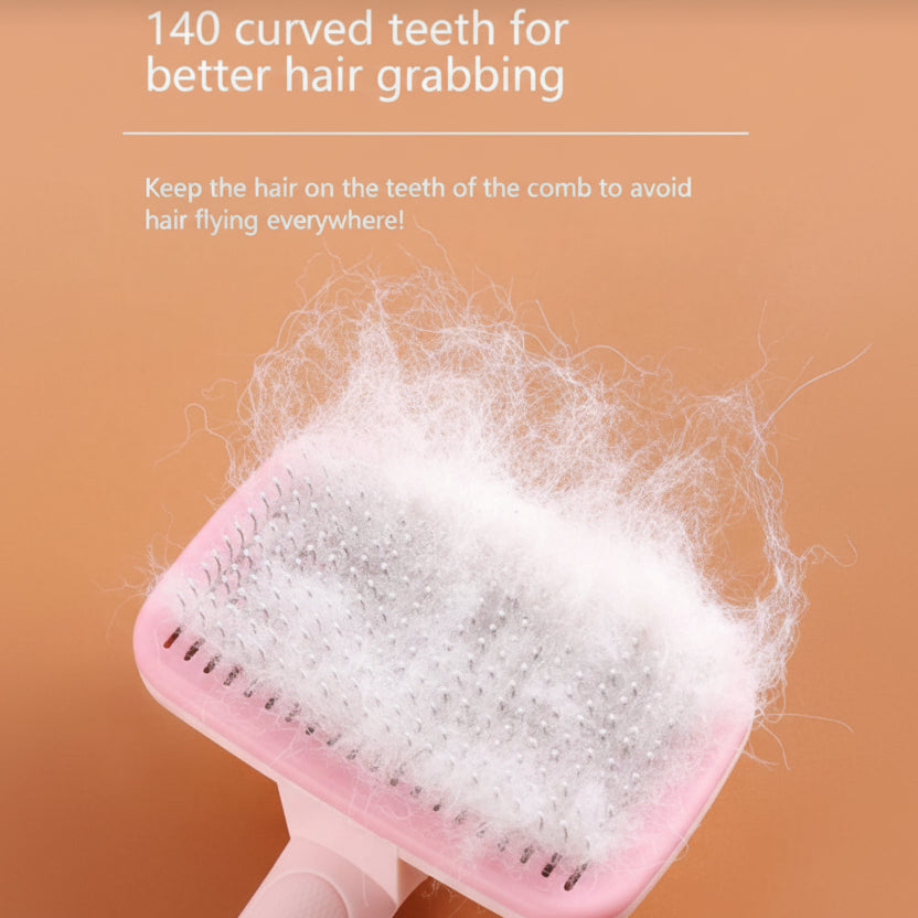 Pink pet grooming brush with curved bristles, filled with white fur against peach background